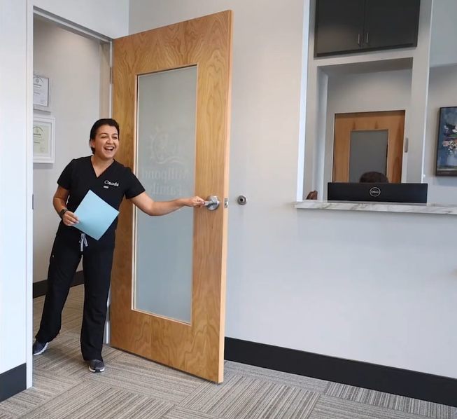 New patient being welcomed at the Cary dentist office